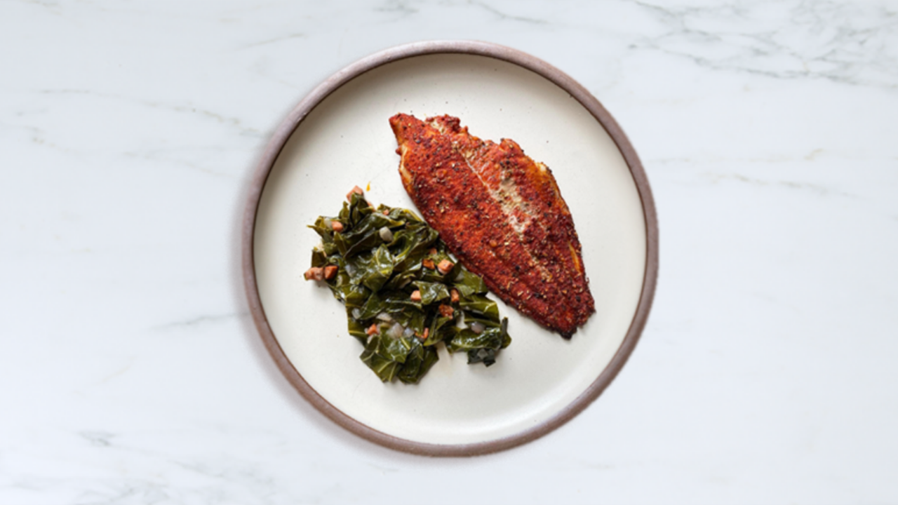 Plate of blackened catfish and greens