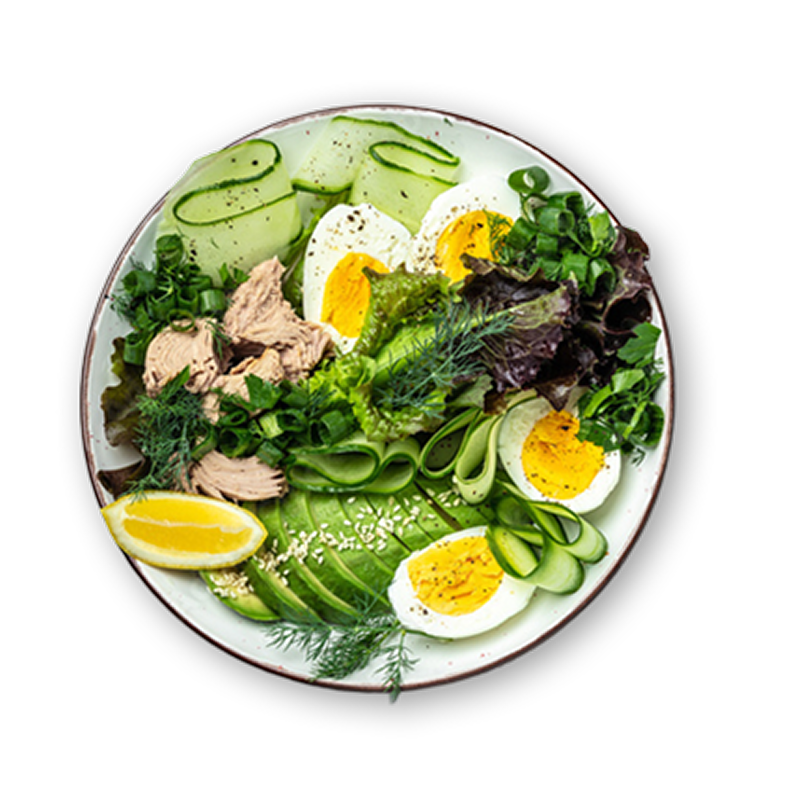 Salad with hard boiled egg, cucumber, avocado, chicken, lemon slice