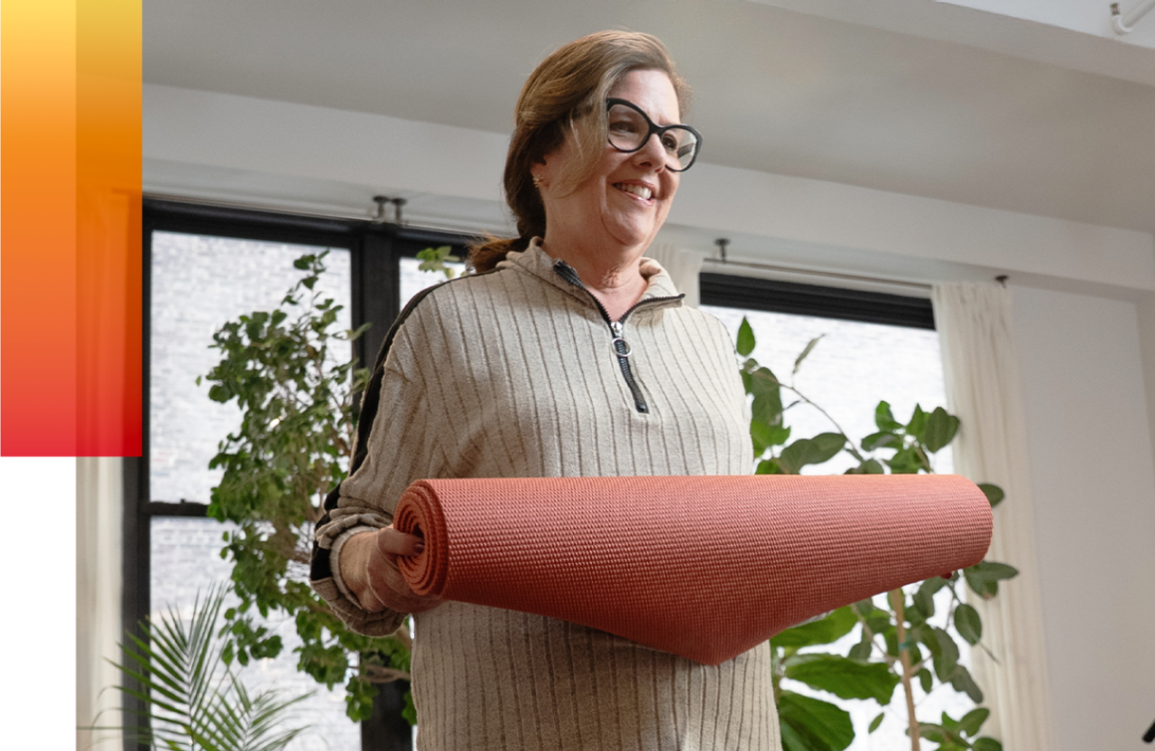 Jane holding a yoga mat