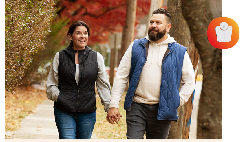 Maria and partner walking holding hands