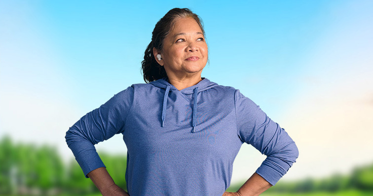 Woman smiling with her hands on her hips